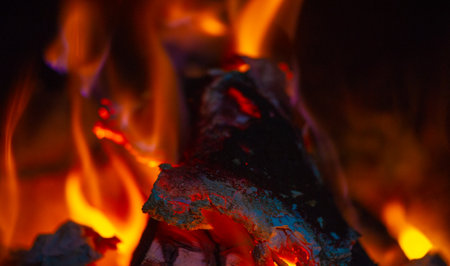 Fire in the fireplace. In the warm light of a campfire, our pupils naturally dilate.の写真素材