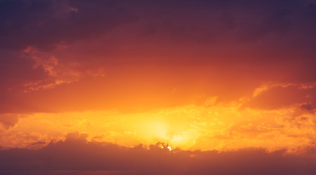 Clouds dawn sunset romance. Proof that few things in life are as beautiful as the setting sun. A picture of the perfect end to the dayの写真素材