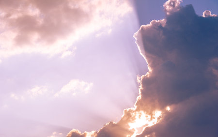 Clouds dawn sunset romance. Endless horizons and the setting sun. The sun says goodnight againの写真素材