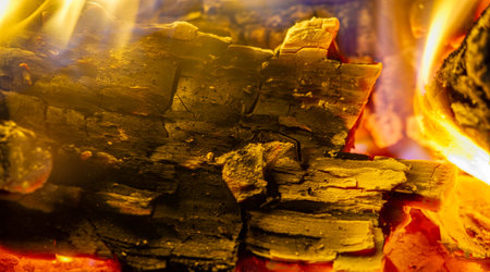 Fire in the fireplace. Fire is beneficial to most of our senses. We love the smell of smoke, the sight of shining light, the sound of crackling logs, the feeling of warmth on our skin.の写真素材