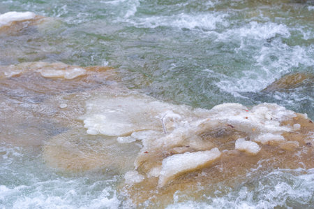 The river freezes in winter. Winter makes me think. As the sun rises later and sets earlier, the hours you can spend on the river are getting shorter.の写真素材