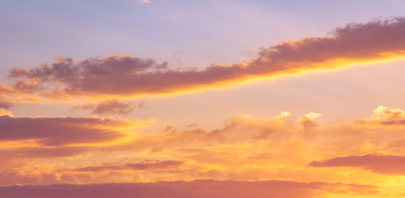 Clouds dawn sunset romance. Gentle romantic pink clouds at dawn. Gentle mood of sunrise, sunset, dusk, sky.の写真素材