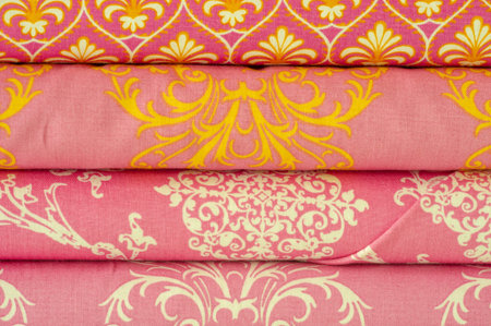 Mix fabrics. Shop counter. Many fabrics of different types. View from above. Printed, cotton, mixed...