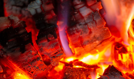 Fire in the fireplace. When we find someone attractive, our pupils dilate, sending a subconscious sign to the other person. In the warm light of a campfire, our pupils naturally dilate.の写真素材