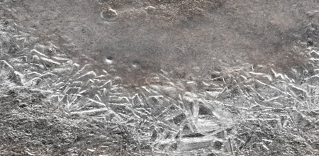 Beautiful ice crystals form a stunning pattern on the surface of the water The art of nature...