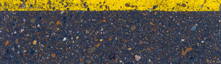 Road markings in the form of yellow stripes Cracked and peeling paint Thermoplastic marking...