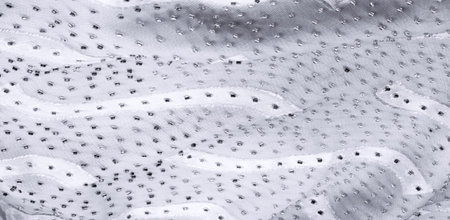 Seamless kaleidoscope. The fabric is silky white and gray. An ultra-modern print and a delicate,...