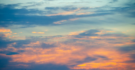 Broken dawn. Crimson clouds, strong red and pink streaks indicate tall clouds reflecting light at...