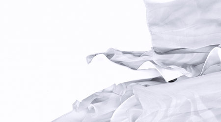 Seamless kaleidoscope. The fabric is silky white and gray. An ultra-modern print and a delicate, airy quality combine in this chiffon with an abstract silk print.の写真素材