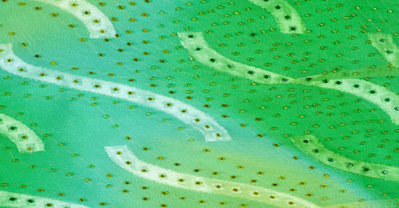 Seamless kaleidoscope. Fabric silk green-blue shades. Vibrant colors and scalloped shapes create a...