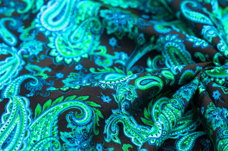 Paisley green pattern on black background In Chinese it is known as âham patternâ In Russia this pattern is known as âcucumbersâ. Boteh is a Persian word meaning bush, bunch of leaves or flower budの写真素材