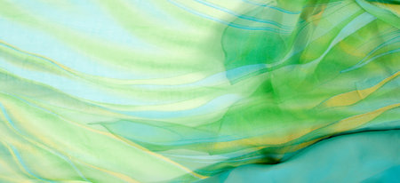Seamless kaleidoscope. Fabric silk green-blue shades. Vibrant colors and scalloped shapes create a...