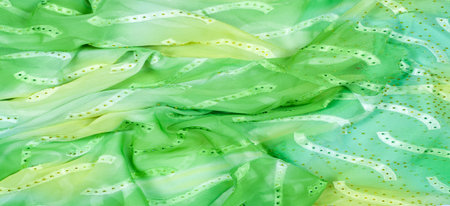 Seamless kaleidoscope. Fabric silk green-blue shades. Vibrant colors and scalloped shapes create a truly unique crepe de chine in yellow, blue and green geometric silk crepe de chine.の写真素材