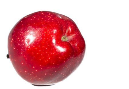 Apple on a white background. They contain pectin, quercetin, procyanidins, and vitamin C, which are beneficial in preventing cancer and disease.の写真素材