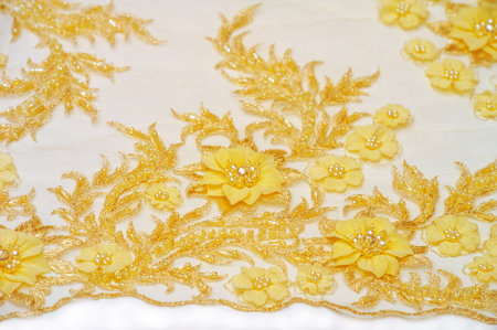 Golden yellow lace background for postcards. posters textures. or wallpaper Old lace lines add a vintage touch to your projects High quality texture samples for a variety of creative projectsの写真素材