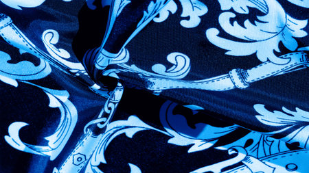 Blue and white monogrammed silk fabric. An exquisite pattern of filigree fabric. texture, background