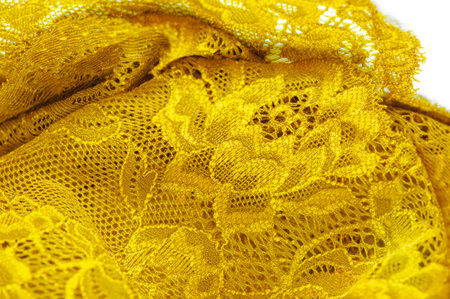 Yellow lace for stylish lingerie and home decor Elastic textile jacquard lace adds beauty and functionality Versatile use as a decorative element. Rubber band or texture for designの写真素材
