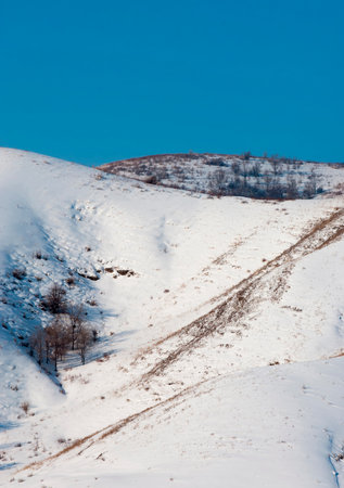 mountains winter and snow. Whether you admire the towering beauty of the mountains from afar or up close, there's no denying how enchanting they are.の写真素材