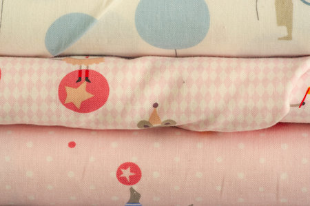 Mix fabrics. Shop counter. Many fabrics of different types. View from above. Printed, cotton, mixed...