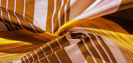 silk fabric with yellow striped pattern. Poncho with Mexican motives. texture, backgroundの写真素材
