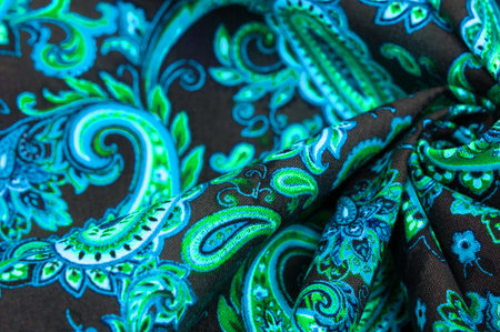 Paisley green pattern on black background In Chinese it is known as âham patternâ In Russia this pattern is known as âcucumbersâ. Boteh is a Persian word meaning bush, bunch of leaves or flower budの写真素材