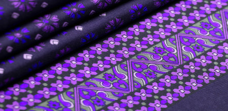 silk fabric of dark blue color with blue and purple flowers, dense fabric, double-sided based on...