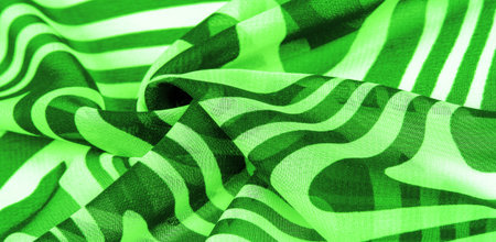 silk fabric, green and white abstract lines. The magical form of abstract white and green pattern....