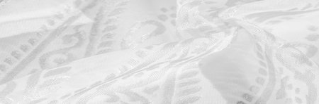 Silk fabric, snow-white fabric. Shades of delicate exquisite flowers on a white background, photo of...
