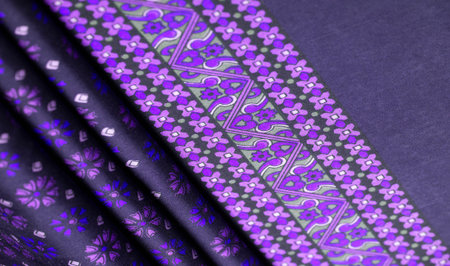 silk fabric of dark blue color with blue and purple flowers, dense fabric, double-sided based on...