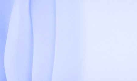 seamless background texture - pale blue silk. Let the nuances of this simple yet sophisticated fabric speak for themselves. Soft, grainy texture, slightly shiny blue colorの写真素材
