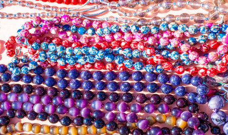 semiprecious stones. Beads pendants decoration. Semi-precious stones are hard gemstones created organically. including lava or ocean hotspots, mines and shells.の写真素材