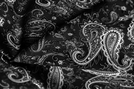 Paisley black-white pattern on a black background. decorated the bandanas of cowboys and bikers popularized by The Beatles, ushered in the era of rock and roll.の写真素材