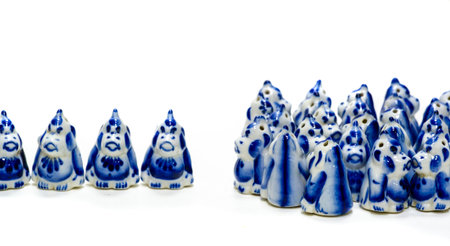 A unique collection of antiques available for purchase A figurine of a man in winter clothes and small children's whistles are among the items on offer Glazed ceramics and Gzhel productsの写真素材