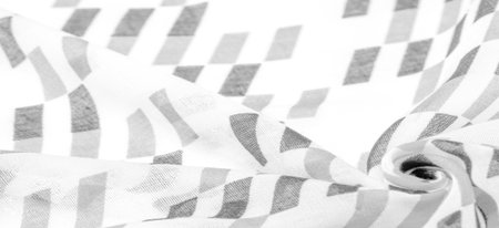 White silk fabric with black geometric rhombus shapes. dark. Background. Template.の写真素材