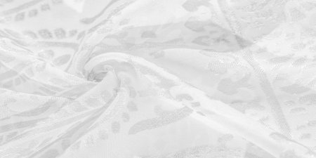 Silk fabric, snow-white fabric. Shades of delicate exquisite flowers on a white background, photo of Paisley print. Texture, pattern, collectionの写真素材