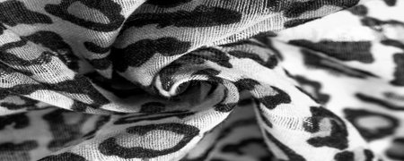 silk fabric black and white with leopard print. Lightweight silk with leopard print will perfectly match your design, looks stylish and not vulgar! Texture, background, patternの写真素材