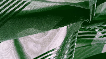 Silk fabric. light transparent silk fabric with stripes of different sizes, green. texture, background, patternの写真素材