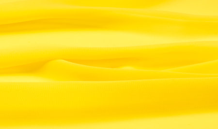 background seamless texture - yellow silk. Premium silk organza in pale yellow is an exceptional fabric, beautiful both on its own and as an accessory in terms of highlighting.の写真素材