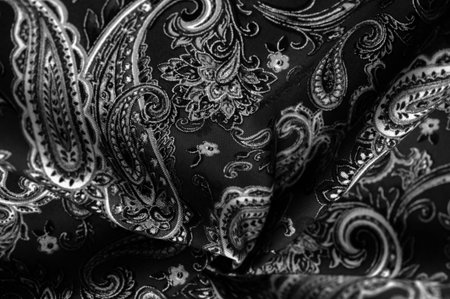Paisley black-white pattern on a black background. decorated the bandanas of cowboys and bikers...
