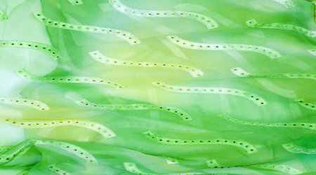 Seamless kaleidoscope. Fabric silk green-blue shades. Vibrant colors and scalloped shapes create a...