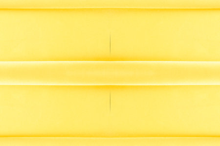 background seamless texture - yellow silk. Premium silk organza in pale yellow is an exceptional fabric, beautiful both on its own and as an accessory in terms of highlighting.の写真素材