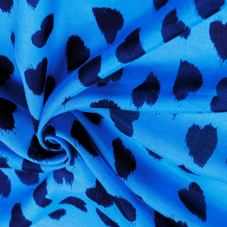 silk fabric, blue print of black hearts, texture background, pattern, postcard,の写真素材