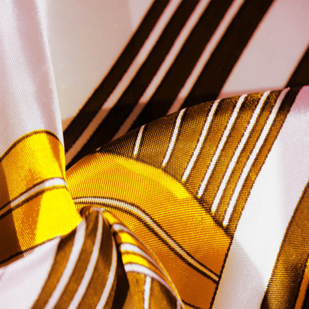 silk fabric with yellow striped pattern. Poncho with Mexican motives. texture, backgroundの写真素材