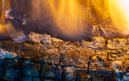 Fire in the fireplace. Fire is beneficial to most of our senses. We love the smell of smoke, the sight of shining light, the sound of crackling logs, the feeling of warmth on our skin.の写真素材