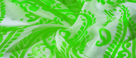 Silk cloth, green cloth. Shades of delicate exquisite flowers on a white background, photo of...