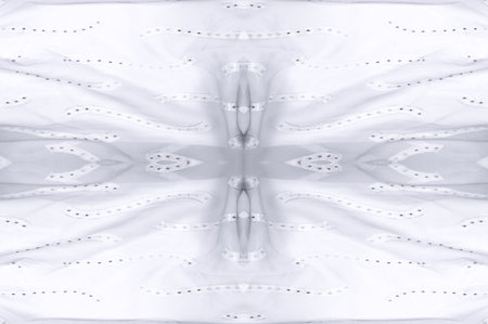 Seamless kaleidoscope. The fabric is silky white and gray. An ultra-modern print and a delicate, airy quality combine in this chiffon with an abstract silk print.の写真素材