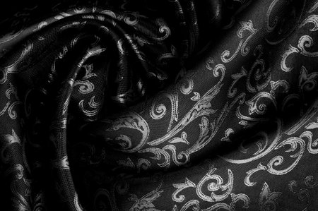 Seamless texture. black color. Made from high quality polyester and silk satin, this satin will embody your inner royal spirit. It is an elegant fabric with a more attractive appearance.の写真素材