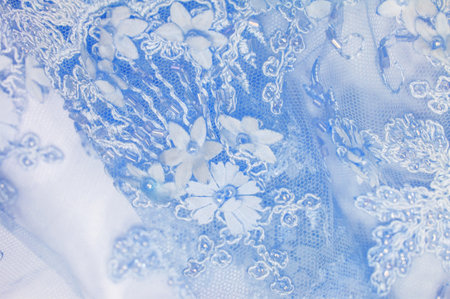 Abstract background design with light blue lace texture. Suitable for use in postcards, posters, wallpapers and textures. Includes sapphire lines for added visual interest.の写真素材