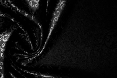 Seamless texture. black color. Made from high quality polyester and silk satin, this satin will embody your inner royal spirit. It is an elegant fabric with a more attractive appearance.の写真素材