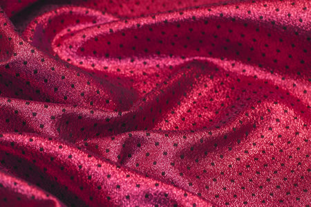 Fabric with a metallic sheen in small polka dots. Red burgundy. Always be a stunning ball champ with...